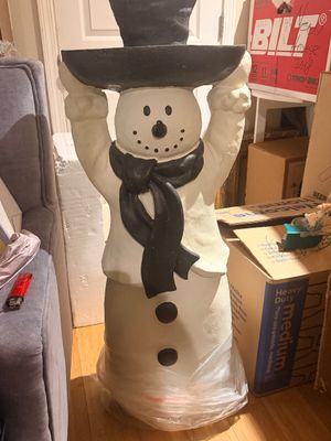 Sale Photo Thumbnail #33: Large white snowman floor statue holding a black tray overhead, complete with a painted black scarf, top hat, and buttons.