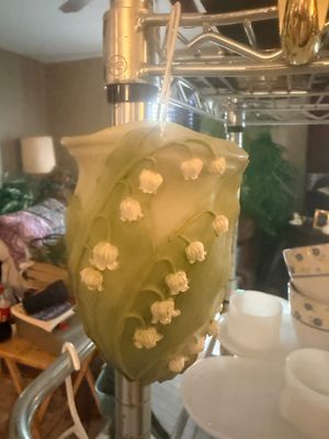 Sale Photo Thumbnail #55: Hanging resin or ceramic wall pocket vase featuring a raised lily of the valley motif in green and white.