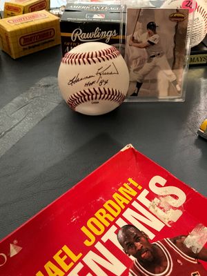 Sale Photo Thumbnail #21: Harmon Killebrew autographed baseball with 'HOF 84' inscription, displayed alongside vintage baseball memorabilia, Matchbox boxes, and a Michael Jordan Valentine box.