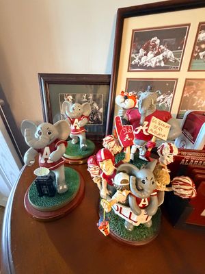 Sale Photo Thumbnail #45: Collection of University of Alabama Crimson Tide Big Al elephant figurines and framed sports memorabilia.
