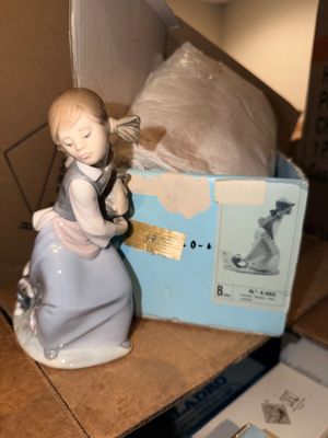 Sale Photo Thumbnail #35: Lladro porcelain figurine #4982 titled "Girl with Lamb", accompanied by its original box.