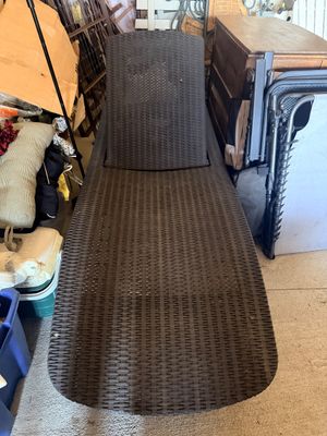 Sale Photo Thumbnail #54: Brown resin wicker outdoor lounge chair with adjustable backrest, surrounded by miscellaneous garage storage items.