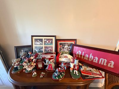 Sale Photo Thumbnail #43: Collection of University of Alabama Crimson Tide memorabilia, including framed prints, Big Al elephant figurines, a lunchbox, and a autographed commemorative football.