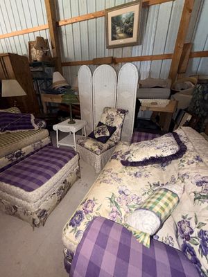 Sale Photo Thumbnail #65: Vintage cottage-style living room furniture set featuring matching purple floral and plaid upholstery, paired with a white wicker folding room divider screen.