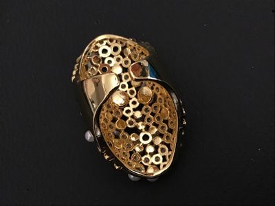 Sale Photo Thumbnail #226: An ornate gold-tone statement ring featuring a cluster of faux pearls, clear rhinestones, and blue accent stones in a lattice/mesh-style setting. An adjustable or open-back band design. Appears in good pre-owned condition with no missing stones visible.