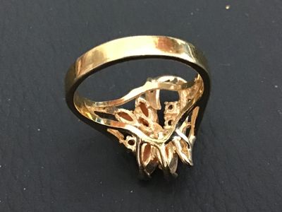 Sale Photo Thumbnail #189: Gold-tone fashion statement ring featuring four marquise-cut coral-pink stones arranged in a floral design, accented with clear round rhinestones. Ring size measures approximately 6 on a ring mandrel. Good condition with light overall wear.