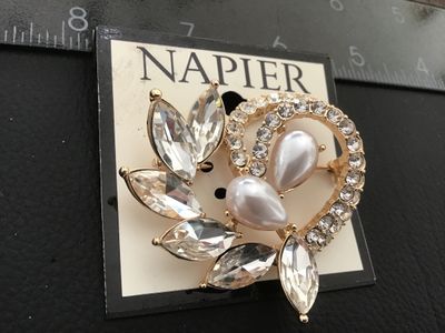 Sale Photo Thumbnail #34: Napier gold-tone brooch featuring marquise-cut clear rhinestones, a pave rhinestone circle detail, and two teardrop-shaped faux pearls. New on original store display card (MSRP $24.00). Pin closure on back in excellent condition. Measures approximately 2 