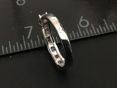 Sale Photo Thumbnail #233: Silver-tone band ring set with five clear cubic zirconia or crystal stones featuring alternating round and square shapes with milgrain border details. Measures approximately size 8 on a ring mandrel. Good condition with minimal wear.