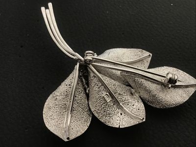 Sale Photo Thumbnail #22: Vintage silver-tone Giovanni brooch featuring an intricate botanical leaf spray design with textured vein details and delicate berry accents. Measures approximately 3 inches in length. Features a secure rollover safety clasp on the back. Stamped with the 