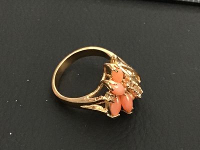 Sale Photo Thumbnail #192: Gold-tone fashion statement ring featuring four marquise-cut coral-pink stones arranged in a floral design, accented with clear round rhinestones. Ring size measures approximately 6 on a ring mandrel. Good condition with light overall wear.