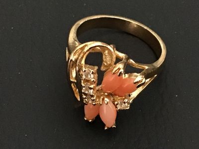 Sale Photo Thumbnail #193: Gold-tone fashion statement ring featuring four marquise-cut coral-pink stones arranged in a floral design, accented with clear round rhinestones. Ring size measures approximately 6 on a ring mandrel. Good condition with light overall wear.