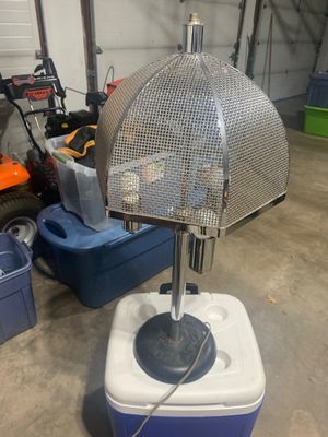 Sale Photo Thumbnail #21: Vintage mid-century modern chrome table lamp featuring a distinctive dome-shaped wire mesh shade and a weighted dark base.