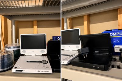 Sale Photo Thumbnail #5: Portable DVD players in white and black finishes, shown alongside a power adapter and spools of blank optical discs.