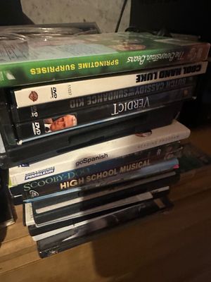 Sale Photo Thumbnail #22: Stack of assorted DVDs including titles such as 'The Berenstain Bears', 'Cool Hand Luke', and 'High School Musical'.