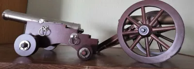 Sale Photo Thumbnail #19: Pair of miniature model cannons with metal barrels and wooden carriages.