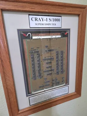 Sale Photo Thumbnail #72: Framed Cray-1 S/1000 supercomputer circuit board module, featuring a descriptive plaque and double-matted presentation in an oak wood frame.