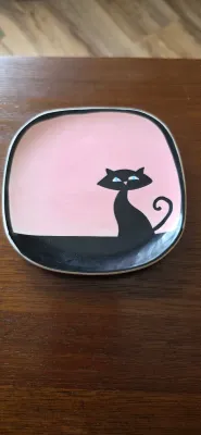 Sale Photo Thumbnail #84: Mid-century modern ceramic trinket dish featuring a stylized black cat illustration on a pink background.