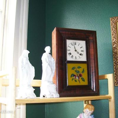Antique clock and Old Paris statues