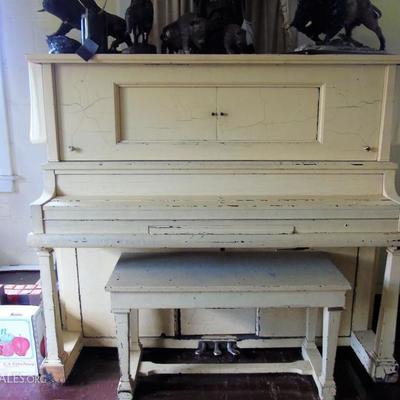 Player piano with rolls.