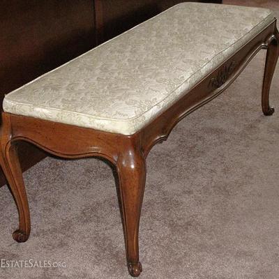 Bench upholstered in beige brocade with cabriole legs.