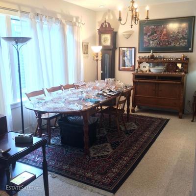 Dining room table made of cherry wood covered in American clear pressed glass, etc.