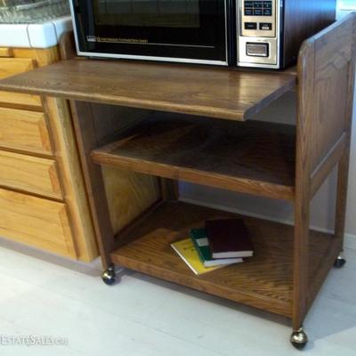 Appliance table with lift up extension.