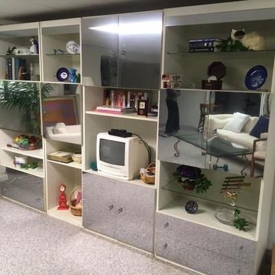 white & mirror wall unit with built-in locking bar