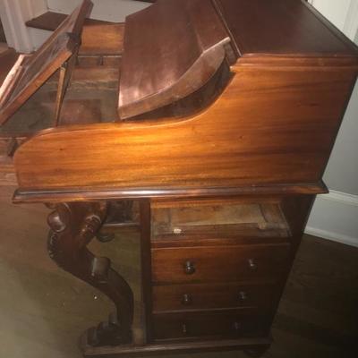 Antique ship captains desk with hidden compartments and top that raises and lowers. This is a fantastic piece! 