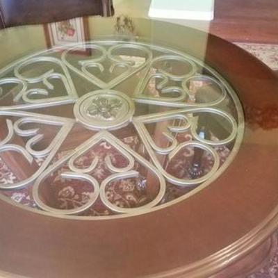 Glass Tops an elegant scrolled metal table top
