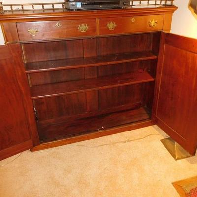 Chippendale mahogany cabinet with brass gallery $399.