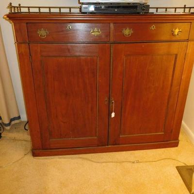 Chippendale mahogany cabinet with brass gallery $399.