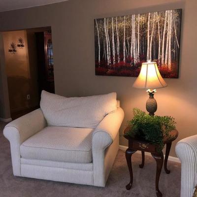  Family Heritage Estate Sales, LLC. New Jersey Estate Sales/ Pennsylvania Estate Sales. White Armchairs. Endtable. Decorative Lamp. Art. 