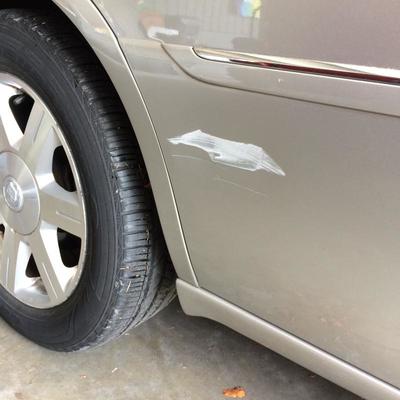 Slight scuff on door panel.