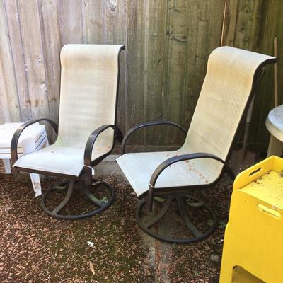 Pair of exterior sitting chairs.