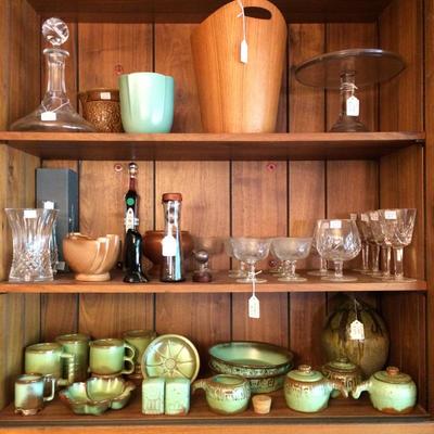 Crystal ship decanter, teak mid century icebox, Waterford Crystal, Heisey glassware, a glass cake stand, etc.