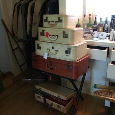 Vintage suitcases and travel accessories.