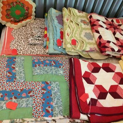 Close up of quilts.