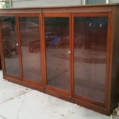 Large antique Boston made bookcase with 8 adjustable shelves.
