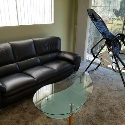 Beautiful black leather contemporary sofa and matching chair