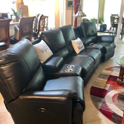 Mylain Black Leather-like Curved Home Theater Seating - 4 power-reclining seats w/2 consoles.