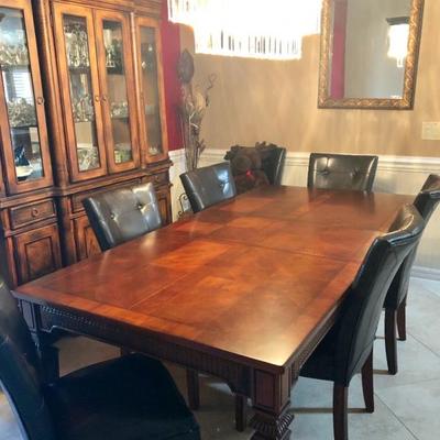 Rectangular "Warm Rum" Dining Table w/wood inlay & 6 Tufted Brown Leather-like Parsons Chairs