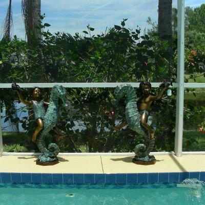 Two bronze sculptures "boy & girl riding seahorses"