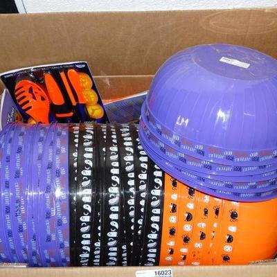 Box of halloween bowls and pumpkin carving kits.