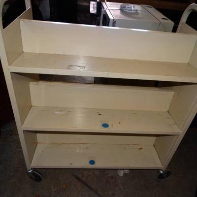 Metal library cart.