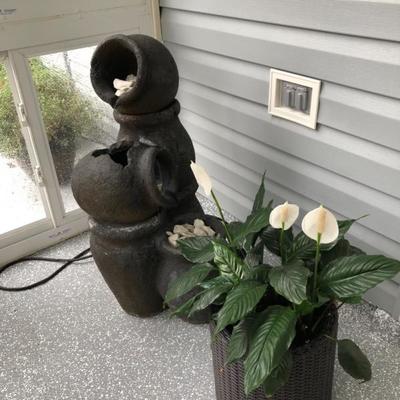 Multi-tier fountain, potted plants