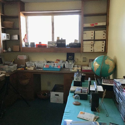 Craft supplies, office supplies, Christmas items, binders, picture frames.  Vintage radios, slide projector, slides, and a lot more