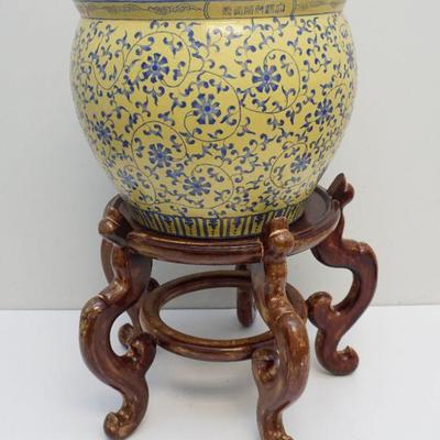 Large 20th c. Chinese Fish Bowl on stand. Yellow with blue floral scrolling vine. Hand painted interior. Measures 27" tall on stand.