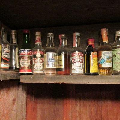 Many vintage mini liquor bottles