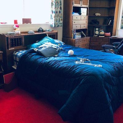 Sports memorabilia and bed.
