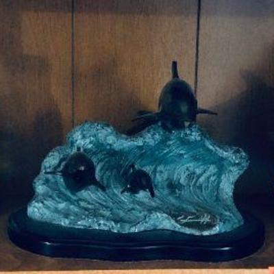 Several dolphins figurines.